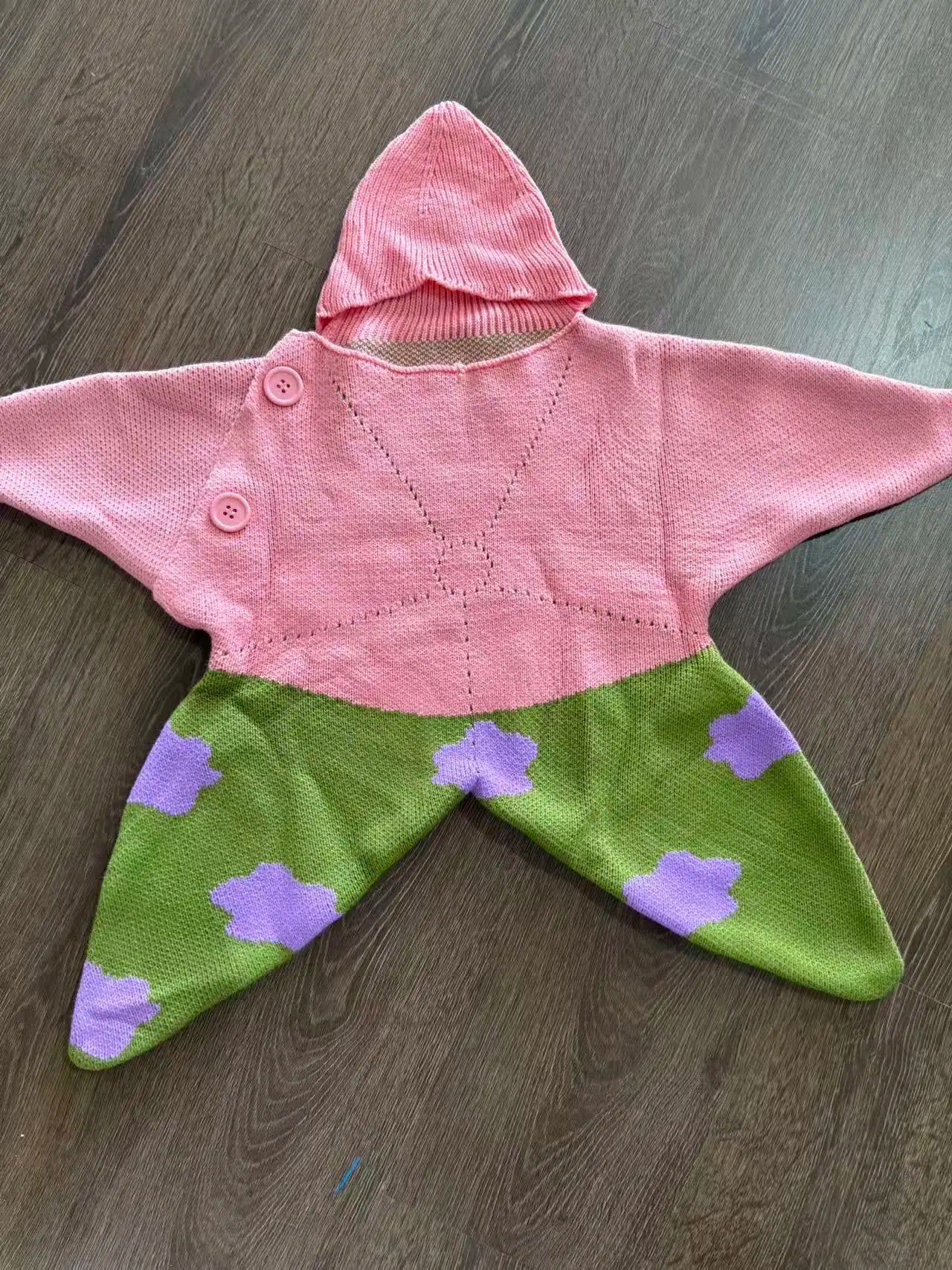 Pink and green Starfish outfit laid flat, showing front detail